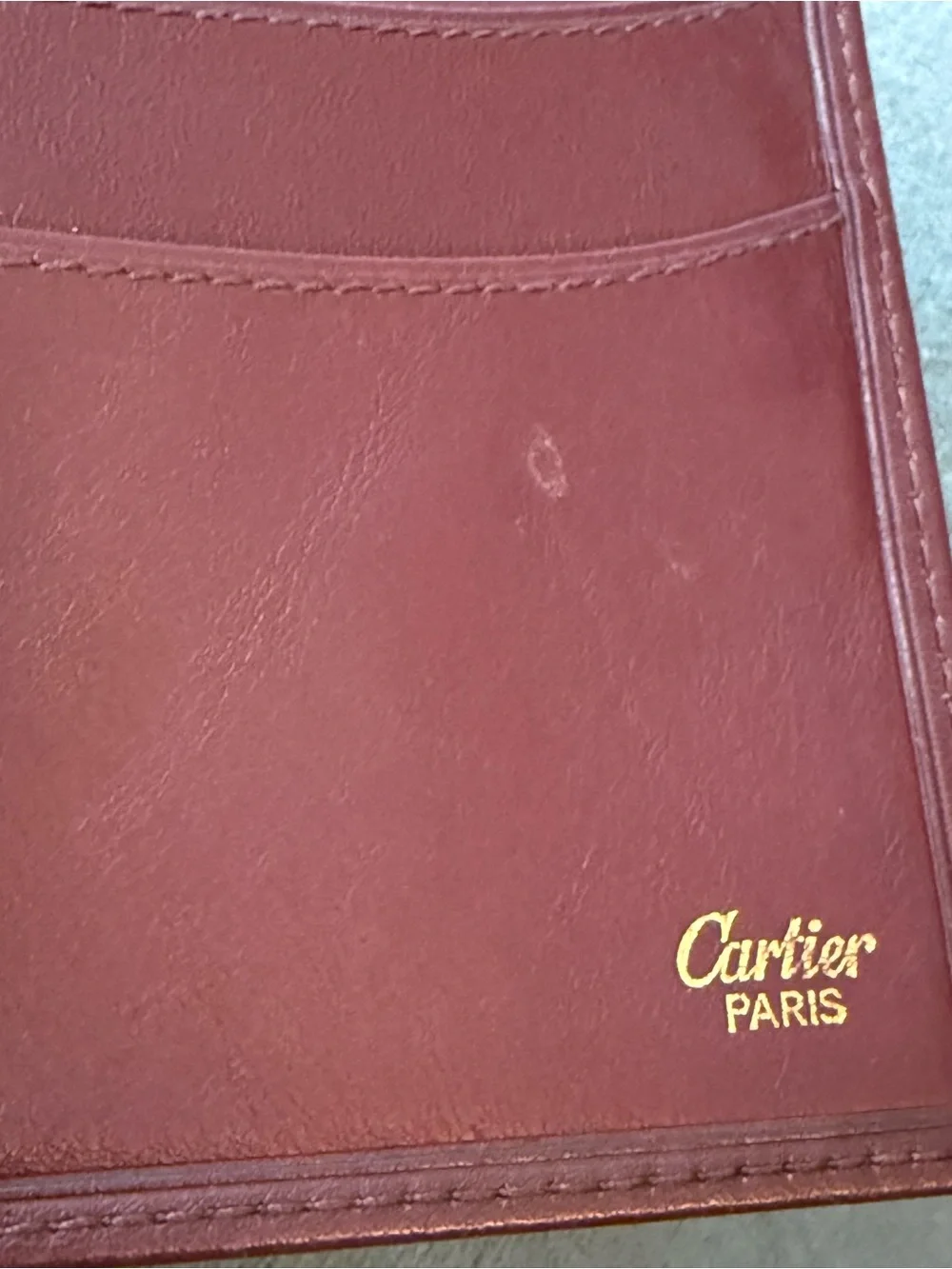Cartier Burgundy Leather Bi-Fold Wallet with Gold Corner Hardware